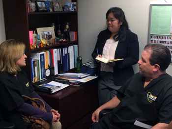 Tricia Rush and Mateo Montoya, both 121RN members and Registered Nurses, talk to a staffer in Assemblymember Evan Low's (District 28) office about AB 1102.